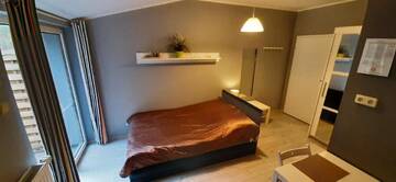 Фото номера Номер-студио с балконом Апартаменты Apartament Słoneczna г. Radzyń 4